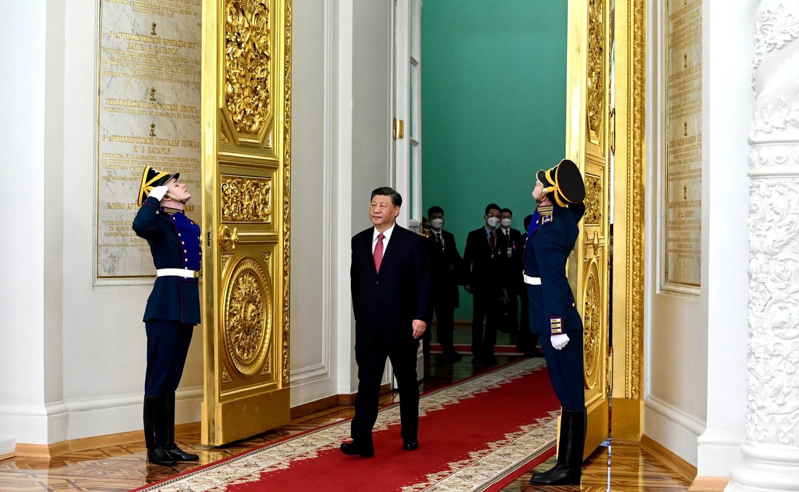 Xi Jinping, President of China, walking on a red carpet.
