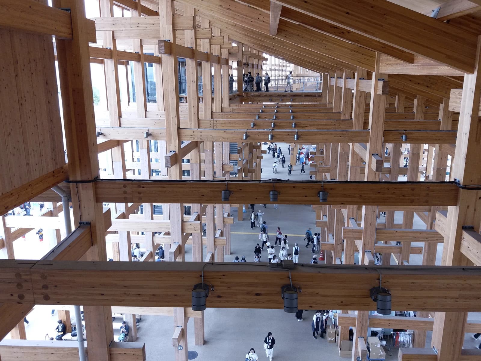 Large wooden architectural structure of the Expo 2025 building in Japan.