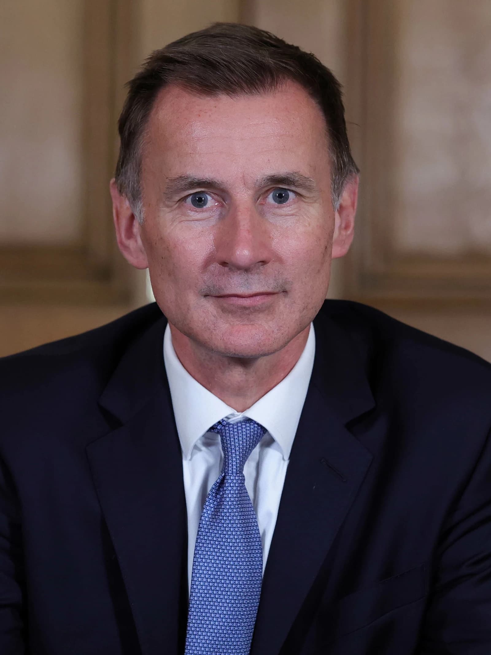 Jeremy Hunt, Chancellor of the Exchequer, looking directly at the camera.