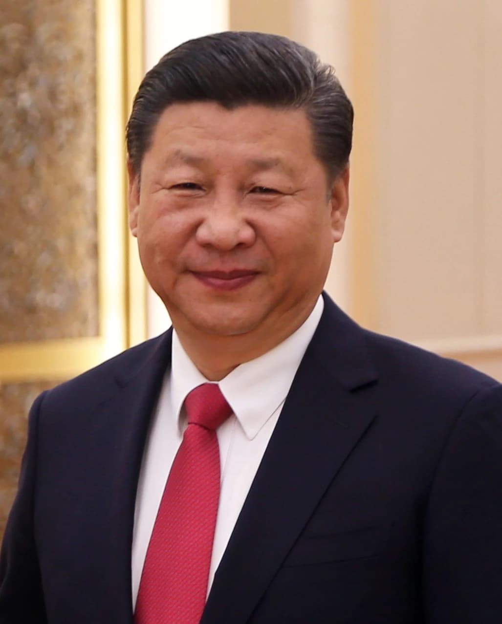 President Xi Jinping of China smiles while looking toward the viewer.