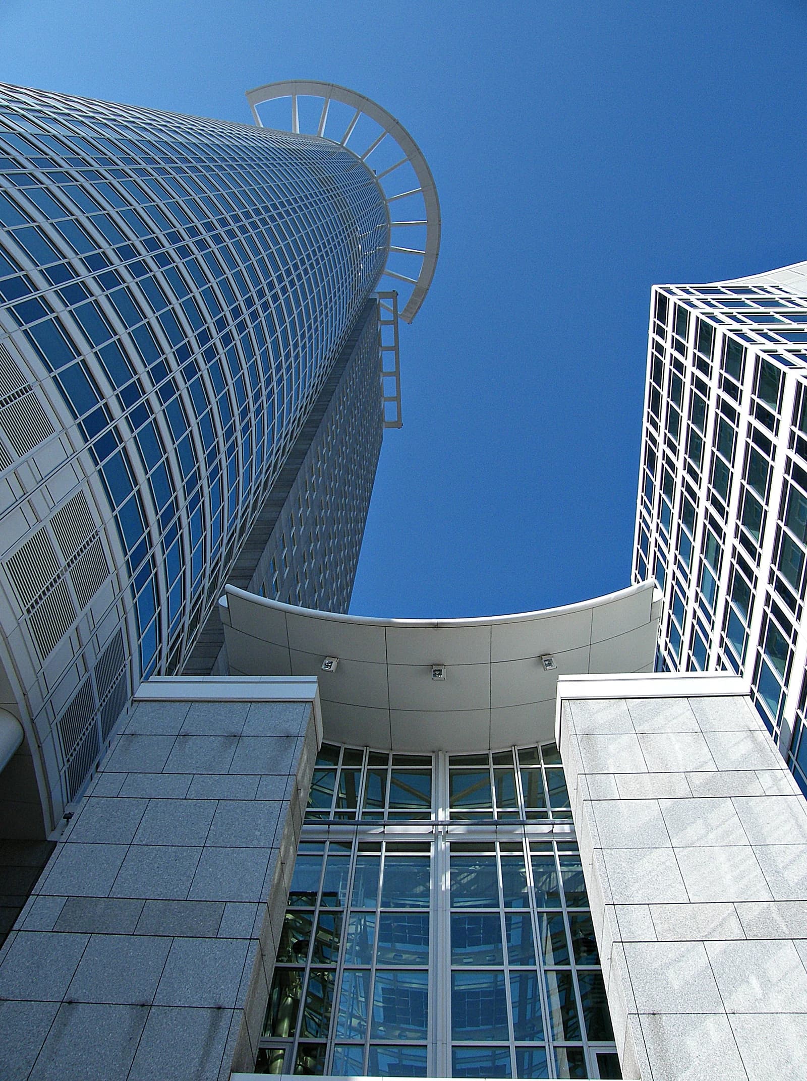DZ Tower skyscraper in Frankfurt, Germany, against a clear blue sky.