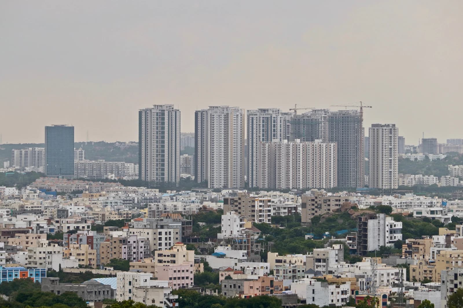 High-rise buildings under construction and completed in Madhapur, Hyderabad, India.