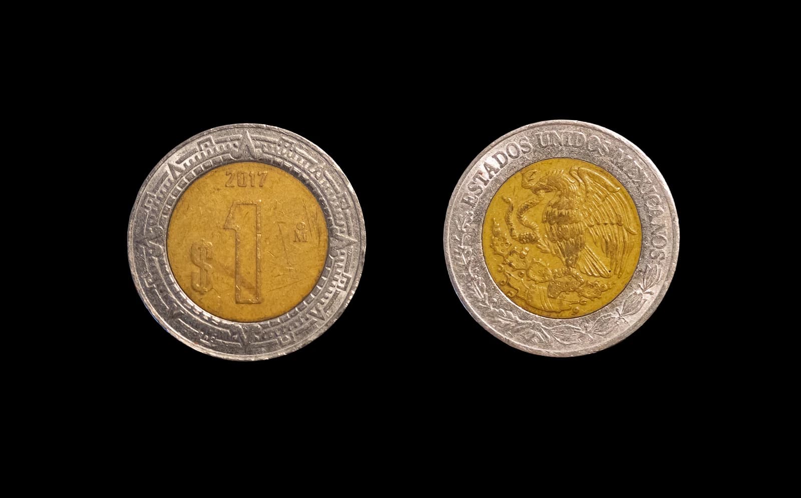 Mexican one peso coin from 2017 showing both sides against a black background.