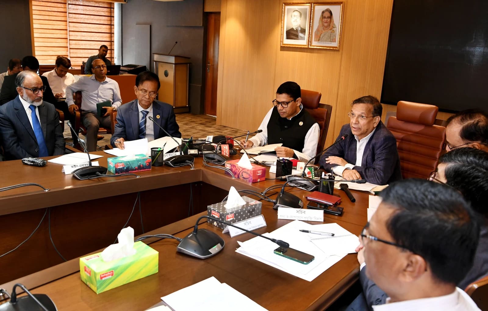 Government officials seated around a conference table discussing the Artificial Intelligence Act.