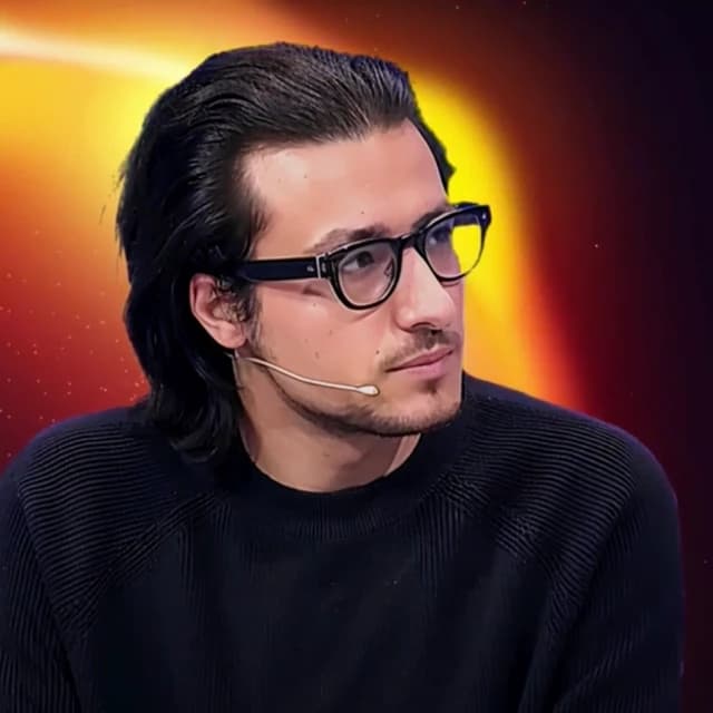 Charles Kantor, financial analyst, wearing glasses and a headset microphone.
