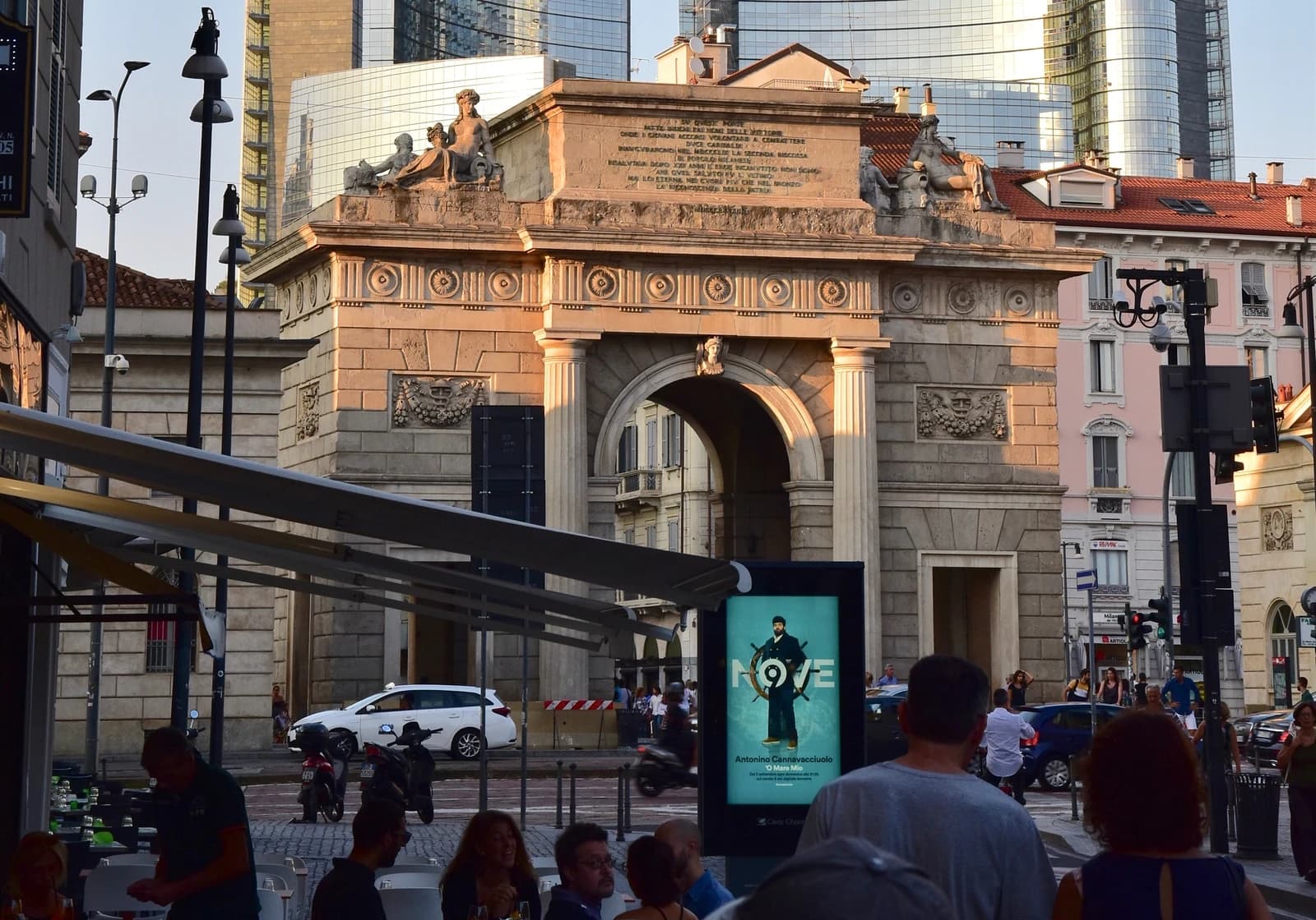 Porta Garibaldi historical arch in Milan with the modern UniCredit Tower visible in the background.