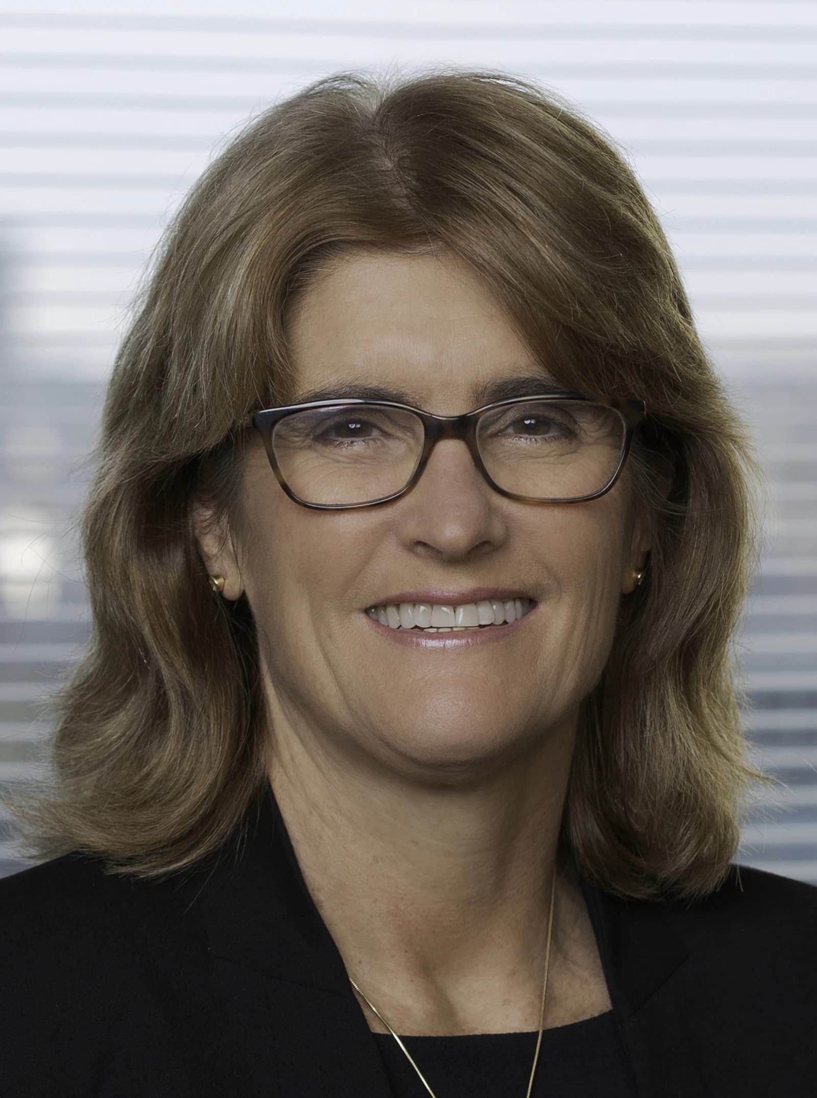 Michele Bullock, Governor of the Reserve Bank of Australia, smiling.