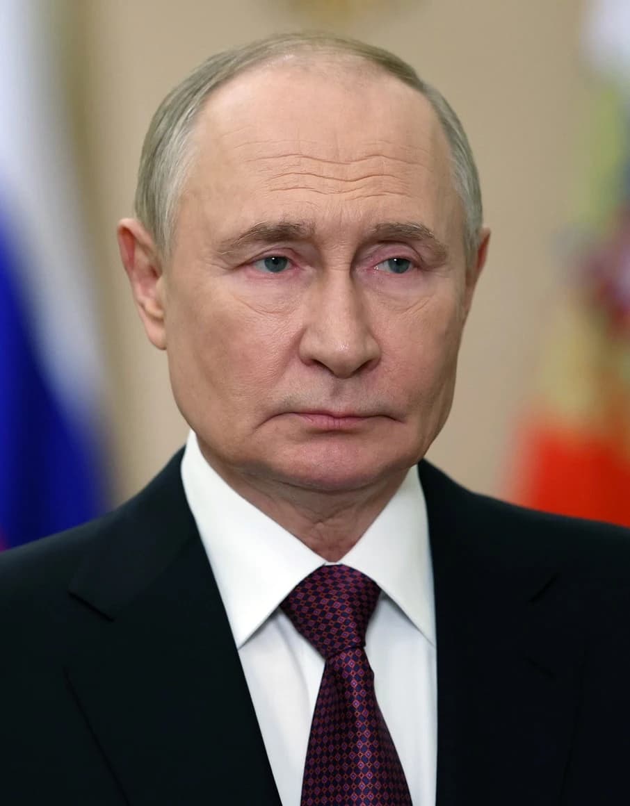 Vladimir Putin, President of Russia, looking directly forward.