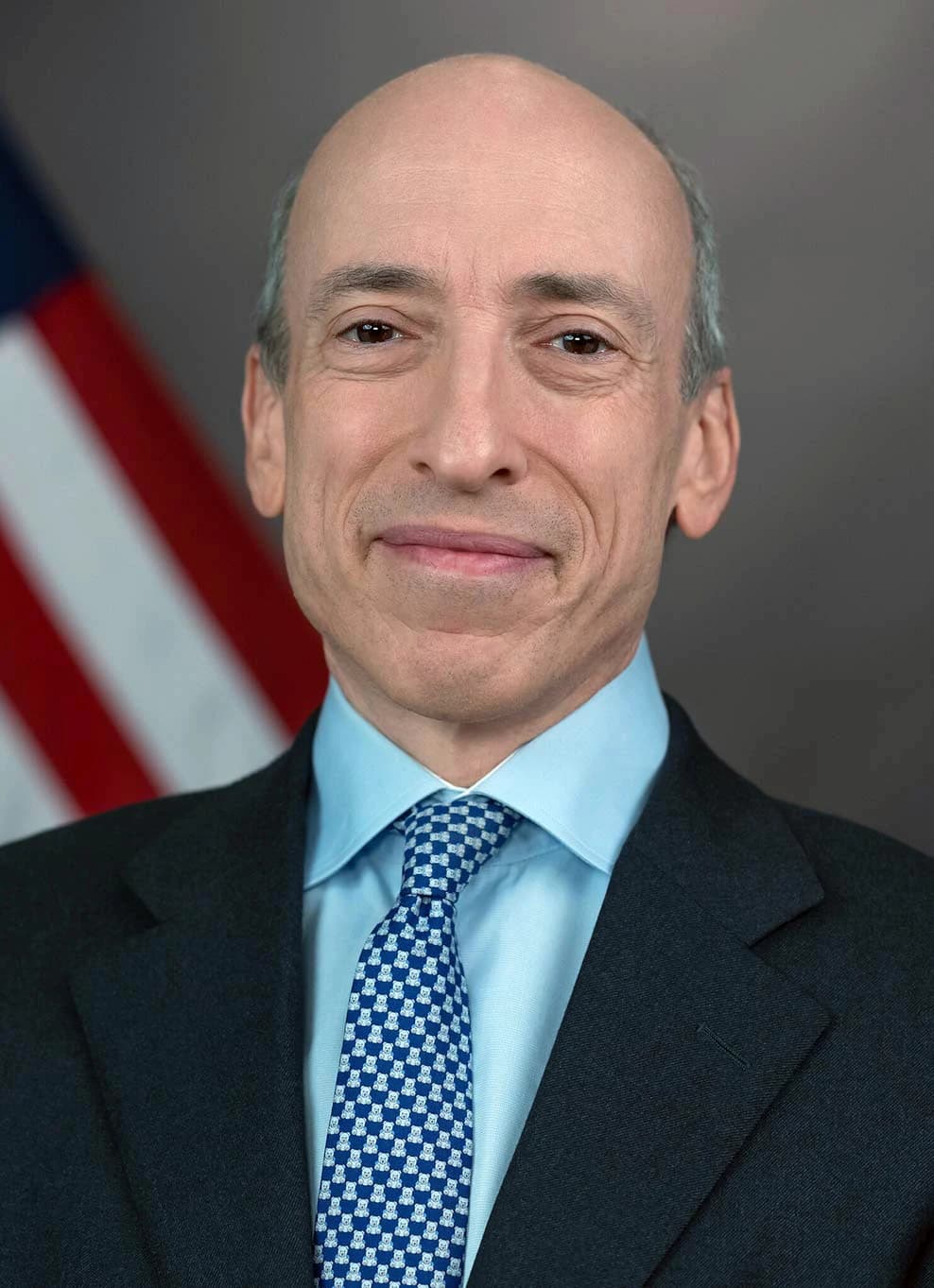 Gary Gensler, Chairman of the SEC, smiling slightly in a professional headshot.