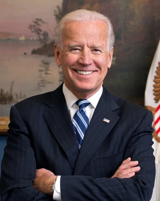 Joe Biden, then Vice President, smiling at a formal event.
