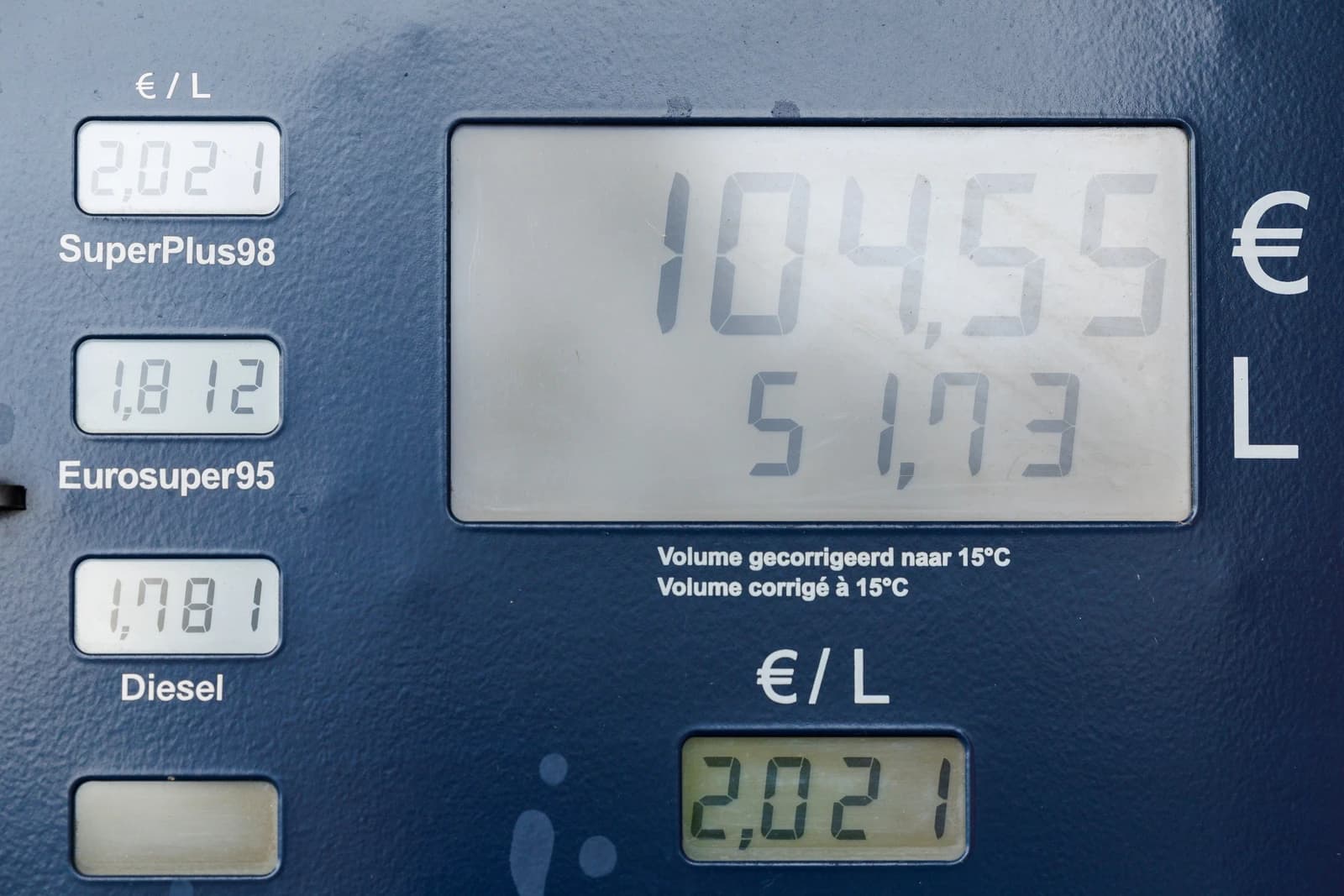 Close-up of a fuel pump display showing prices per liter for various fuel types.