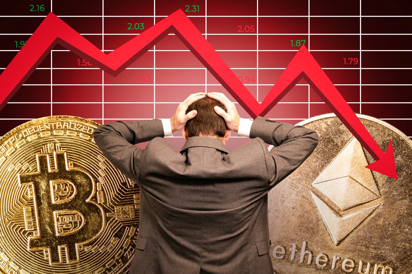 Man holding his head, looking at a red downturn graph, with Bitcoin and Ethereum coins.