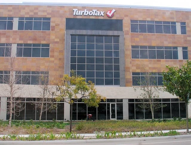 Exterior of the TurboTax headquarters building, a multi-story office building with brown and grey facade.
