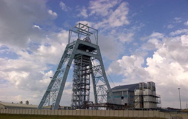 Phakisa Shaft headgear and accompanying industrial buildings at a Harmony Gold mine.