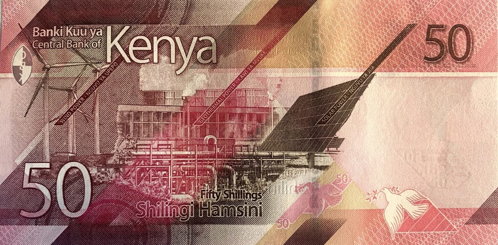 Reverse of a Kenyan 50 Shilling banknote depicting wind, geothermal, and solar power installations.