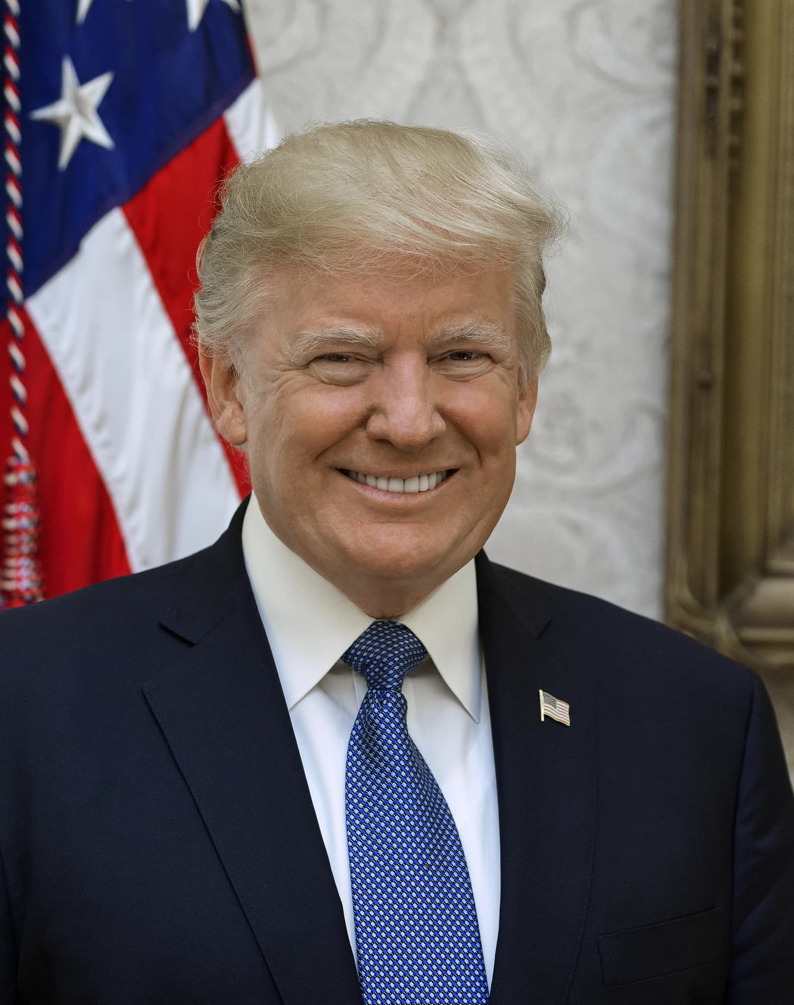 Donald Trump, former President of the United States, smiling in an official portrait.