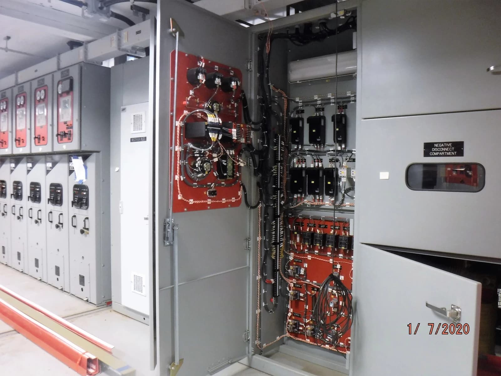 Equipment compartments and wiring inside a traction power substation in Queens, New York.