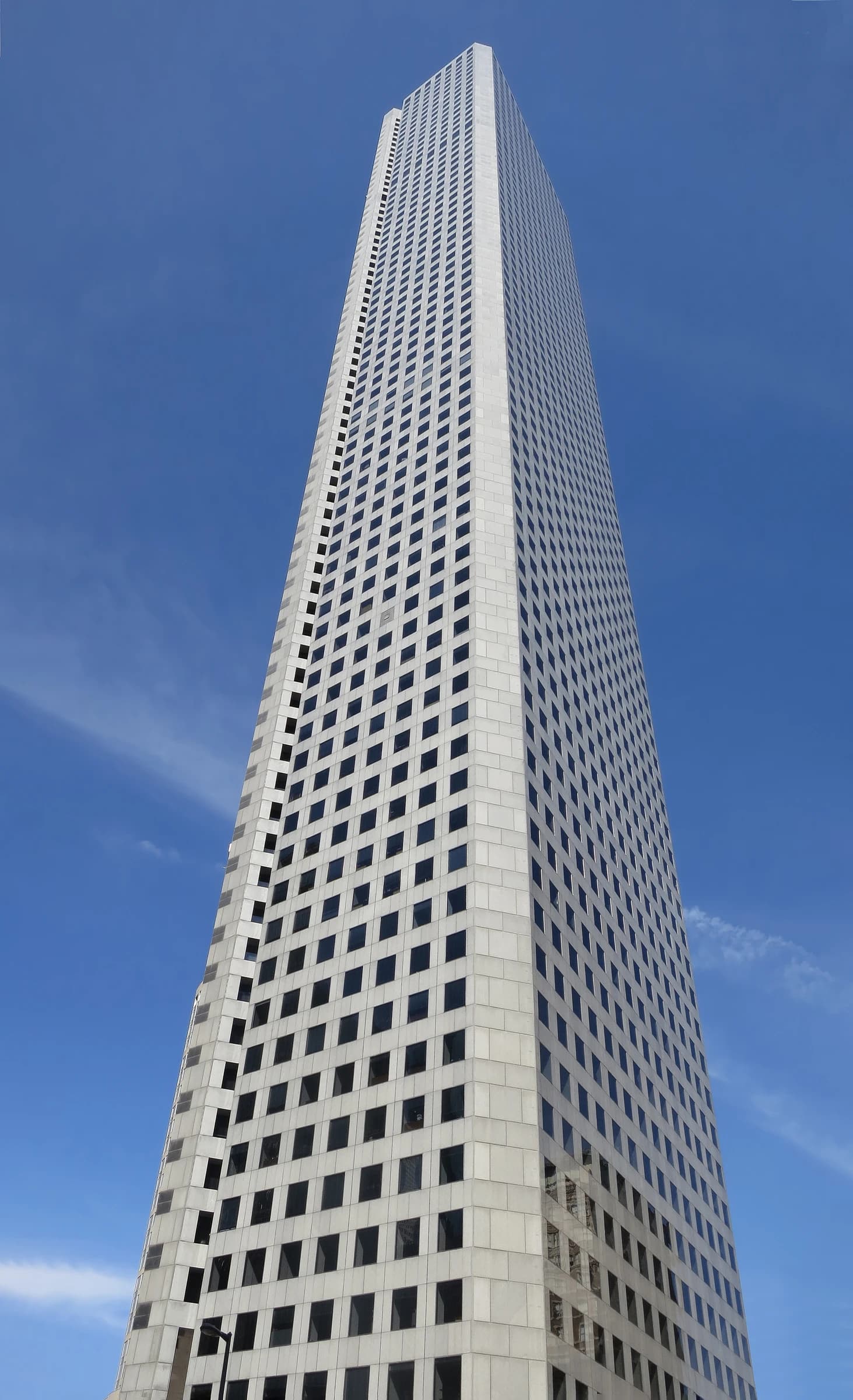 JPMorgan Chase Tower building in Houston, Texas, under a clear blue sky.