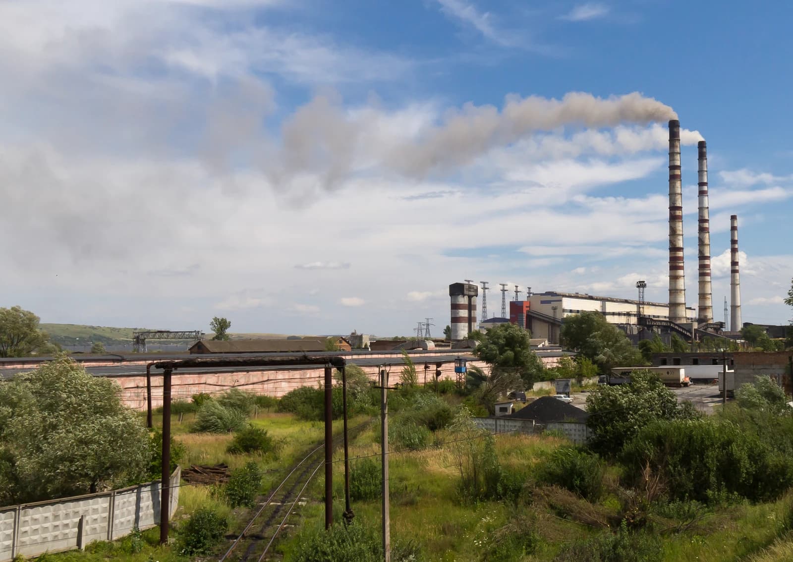Burshtyn TES coal-fired power plant in Ukraine with smoking chimneys.