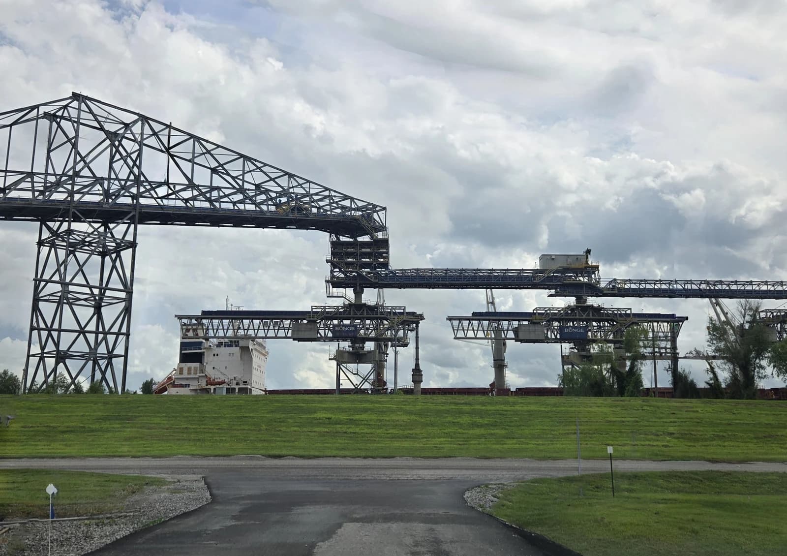 Bunge Destrehan Export Terminal with grain loading infrastructure and a large bulk carrier ship.