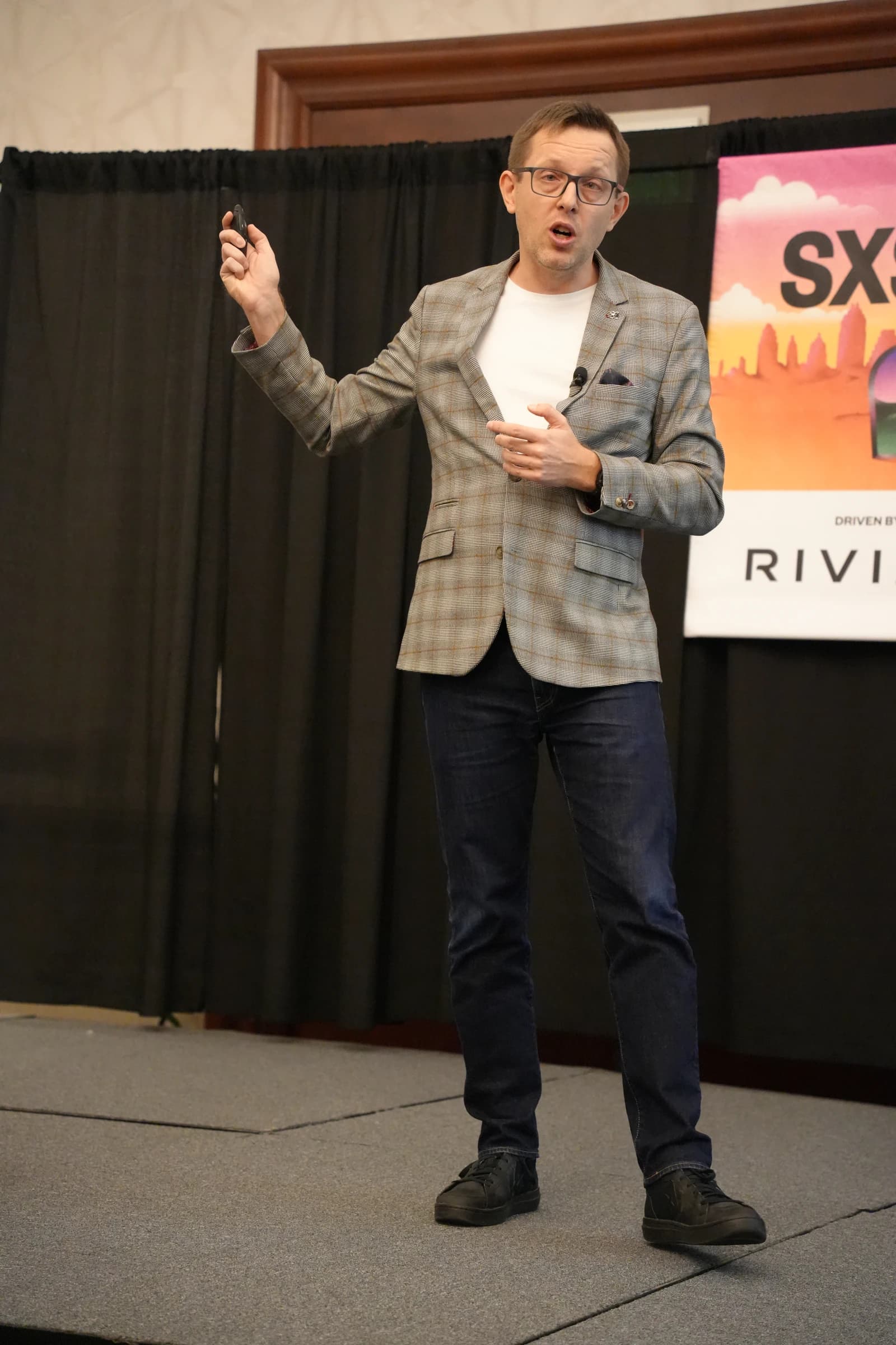 Marek Kowalkiewicz, professor of digital economy, speaking on stage at SXSW 2025.