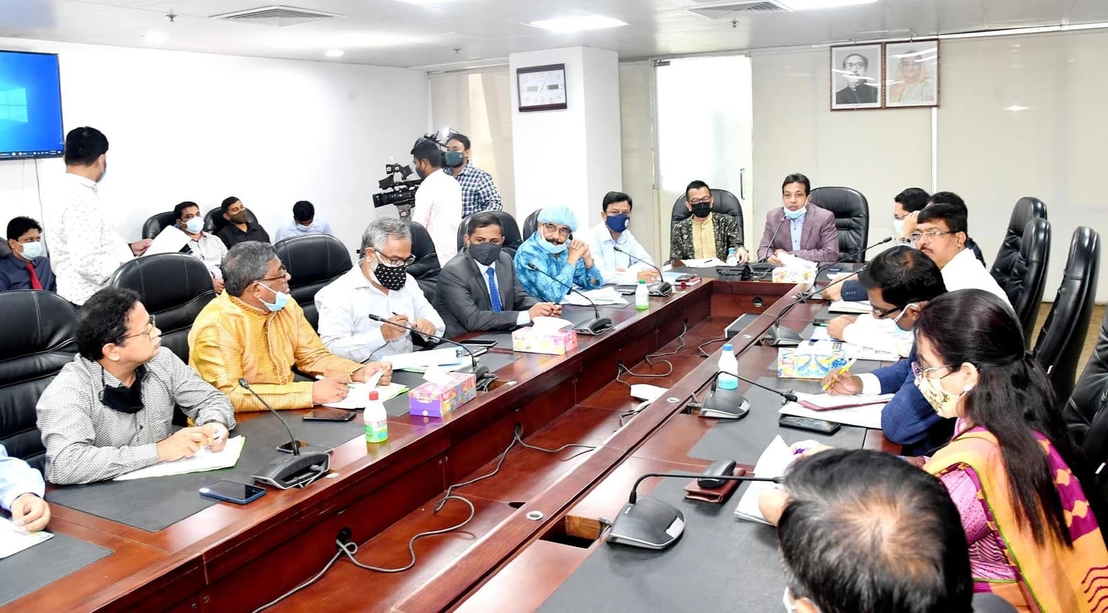 Representatives of Bangladesh Road Transport Authority and Bus Owners Association attend a meeting.