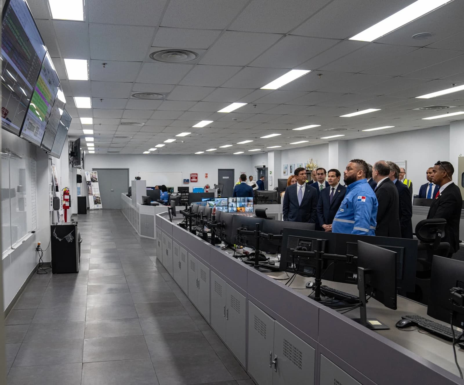 Secretary Rubio and a group of officials observe a control room at a liquified natural gas facility.