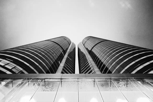 Twin towers of Exchange Square in Hong Kong's Central district, viewed from below.