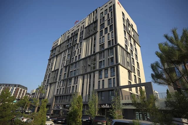 Facade of Abay 130 residential complex at Abay Avenue in Almaty, Kazakhstan.