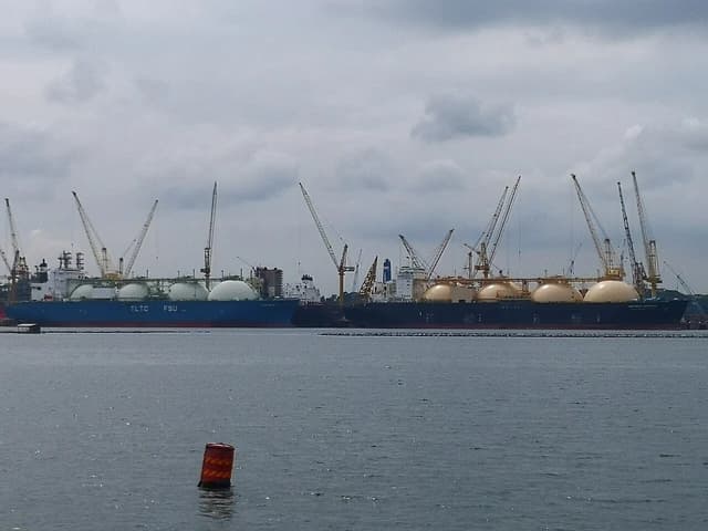 LNG carriers with large spherical tanks docked at Sembawang, Singapore.