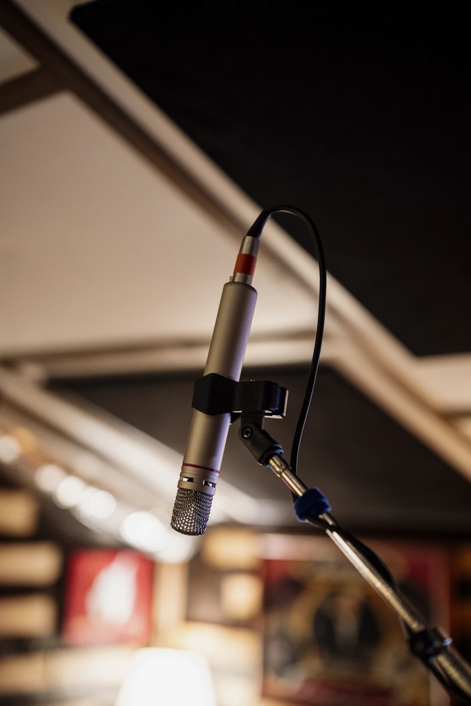 Close-up view of a microphone set up in a recording studio.