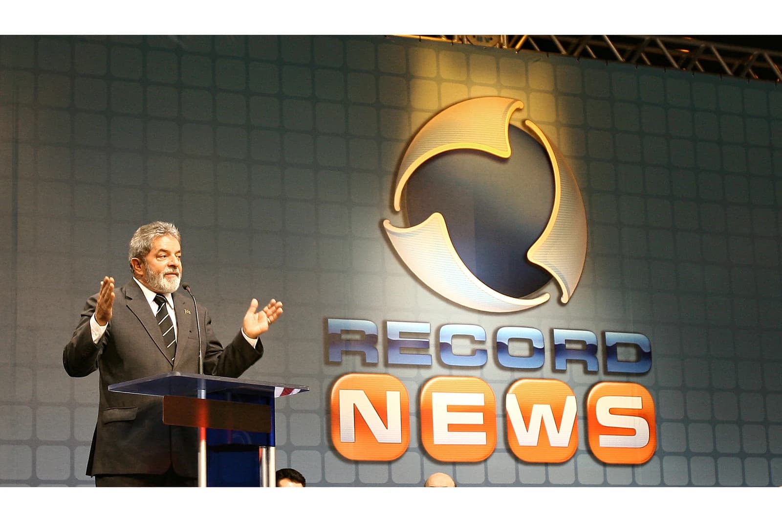 Luiz Inácio Lula da Silva, former President of Brazil, speaks at a podium.