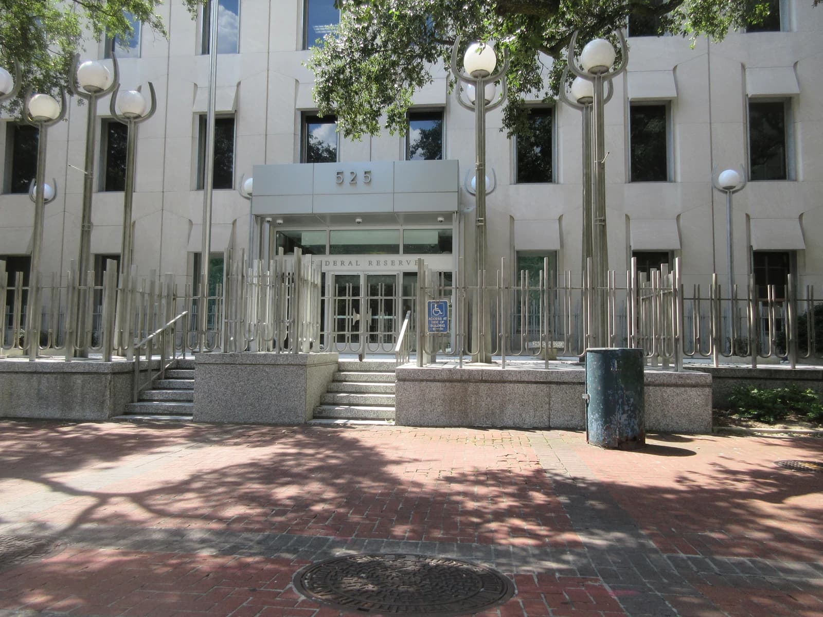 Exterior view of the New Orleans Federal Reserve Bank Building entrance on St Charles Avenue.