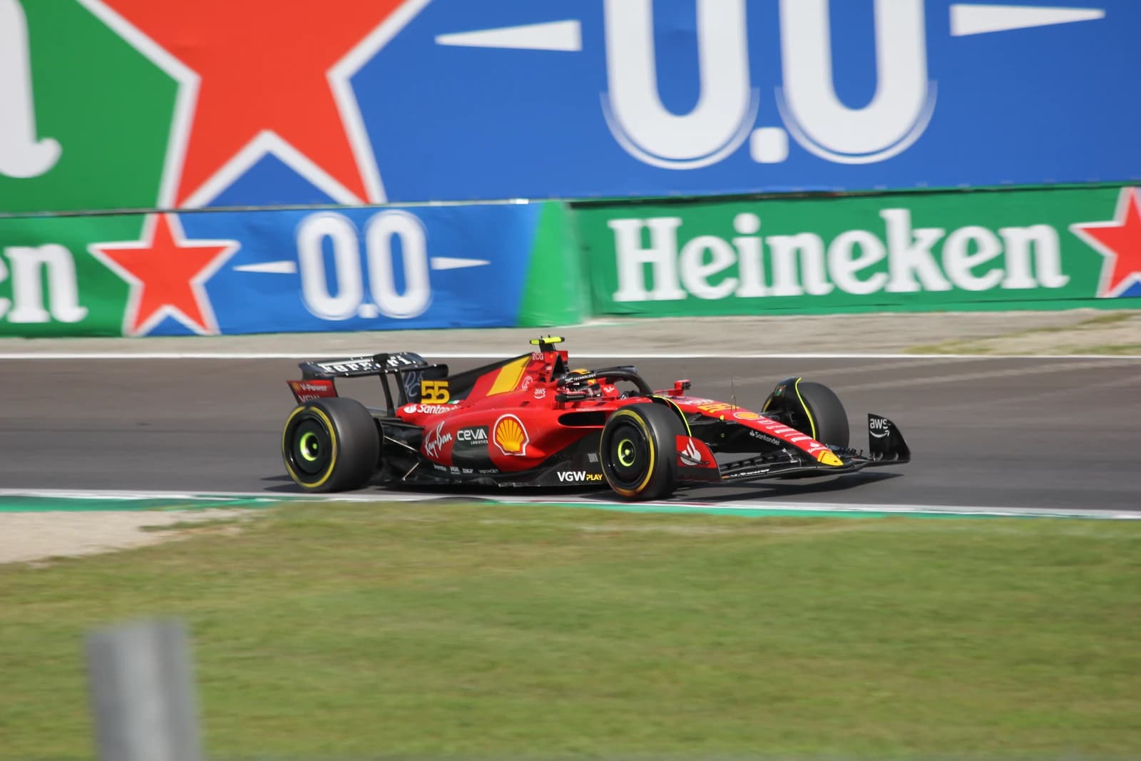 Carlos Sainz, Ferrari Formula 1 driver, racing his car on the track.