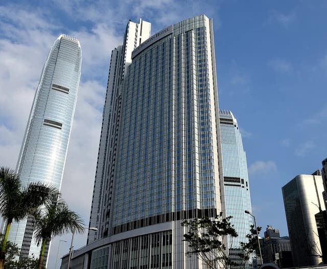 Exterior view of the Four Seasons Hotel and IFC Tower in Hong Kong.