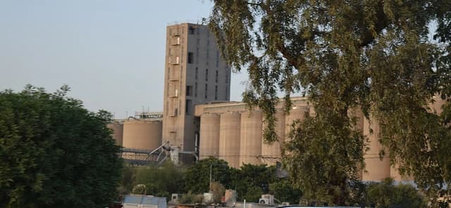 An outdoor view of a grain silo facility in Baghdad, Iraq.