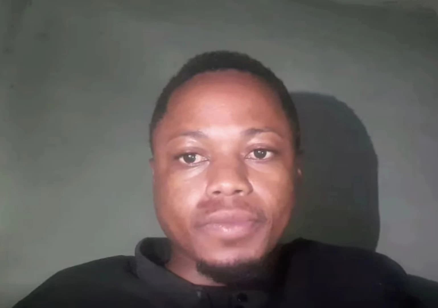 Daniel Motaung, content moderator and activist, looks directly at the camera.