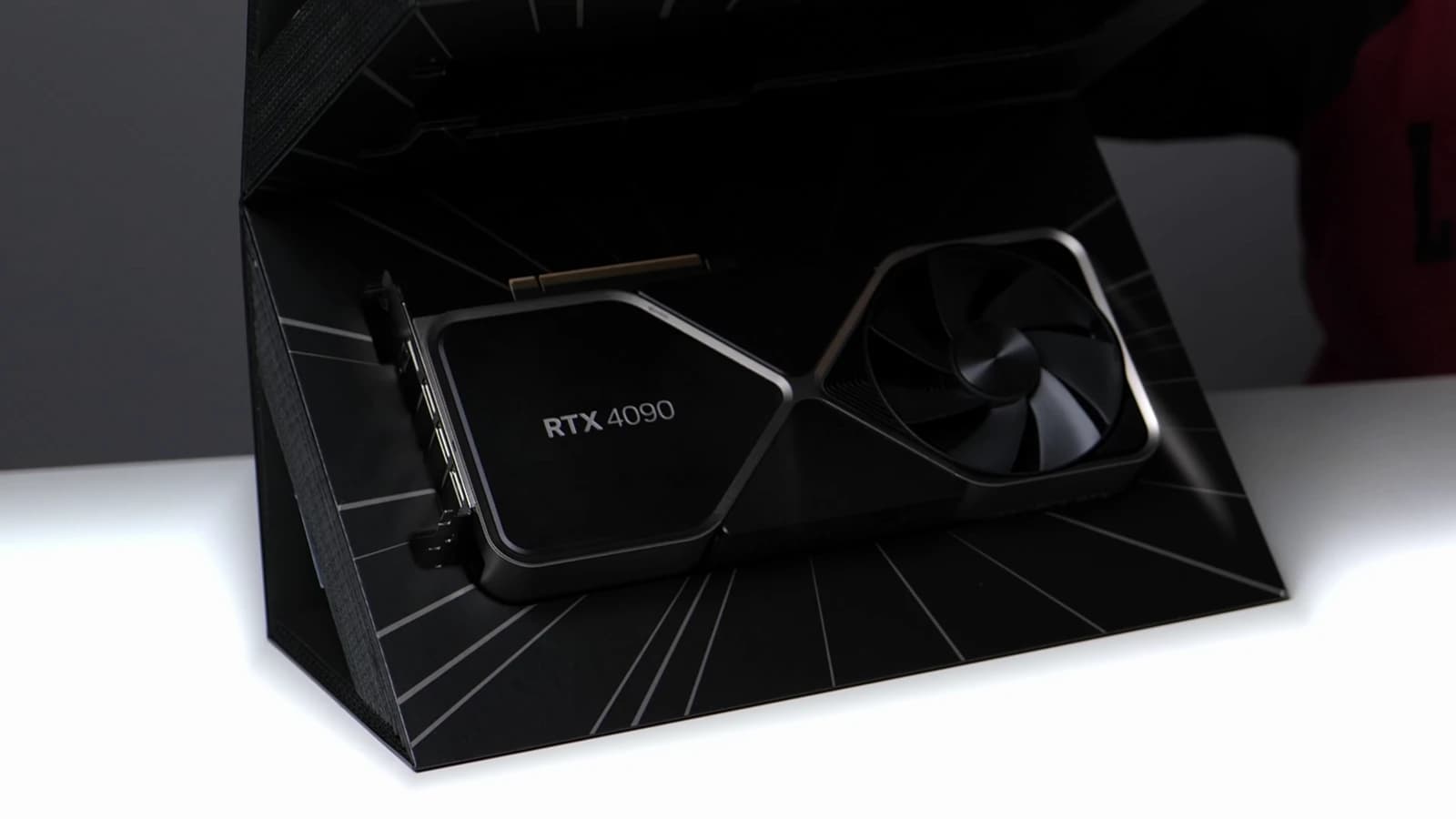 NVIDIA RTX 4090 Founders Edition graphics card resting in its open box.