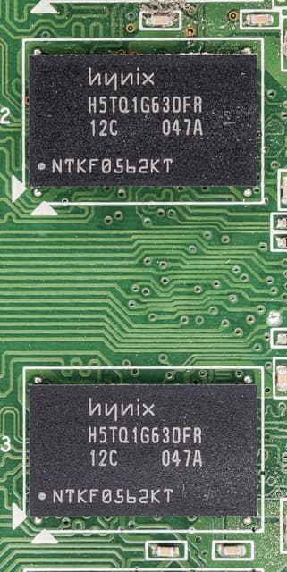 Close-up of Hynix H5TQ1G63DFR memory chips on a green circuit board.