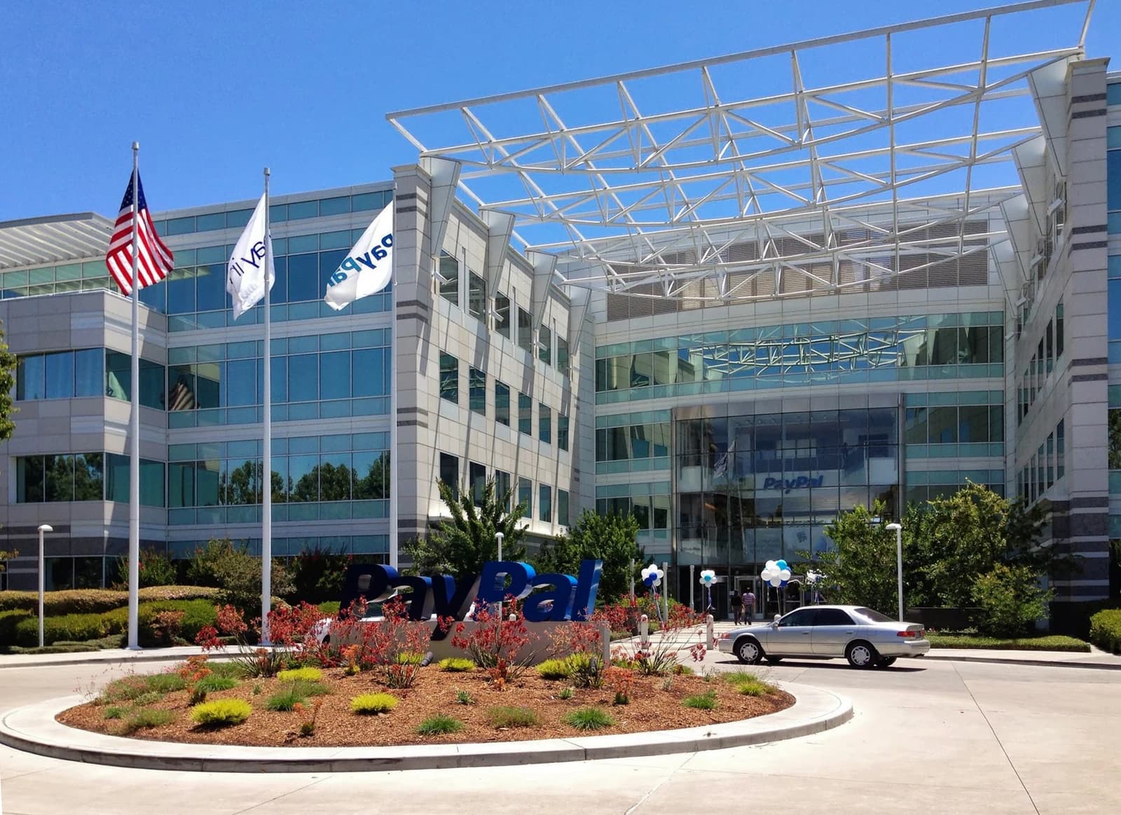 Exterior of the PayPal headquarters building with a large PayPal sign in front.