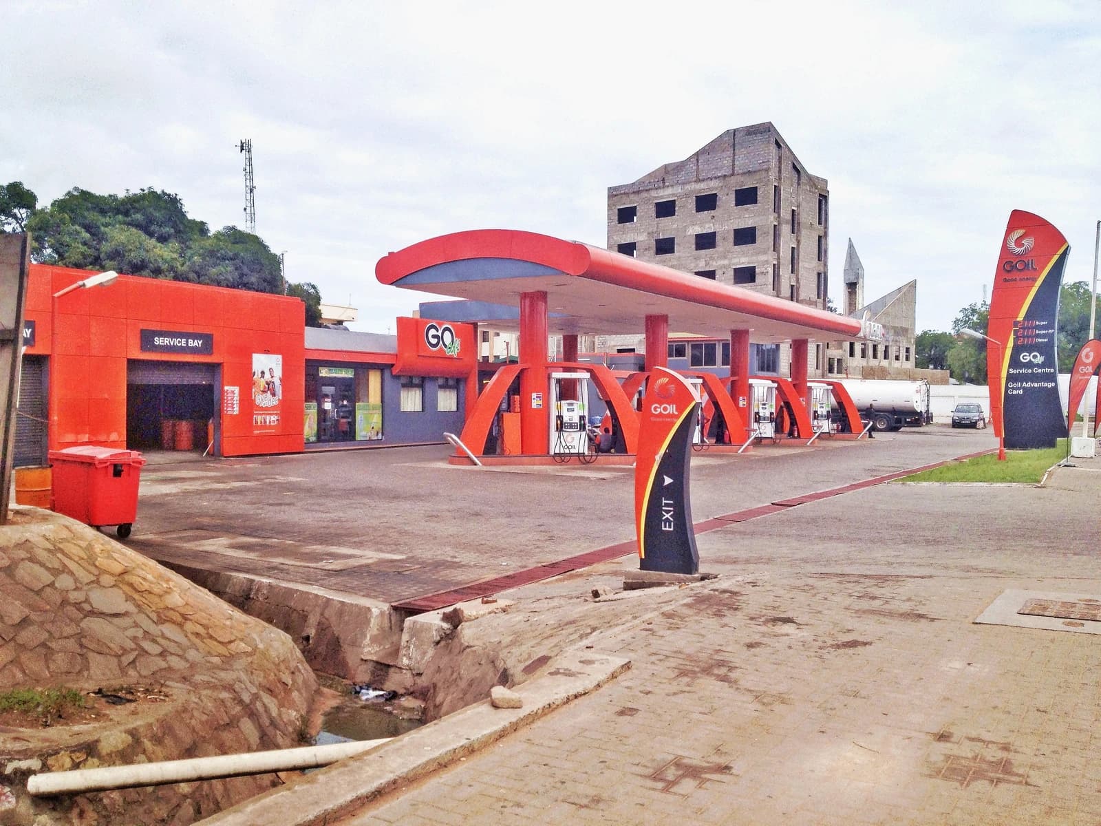 GOIL gas station in Accra, Ghana, with red and blue canopy over fuel pumps.