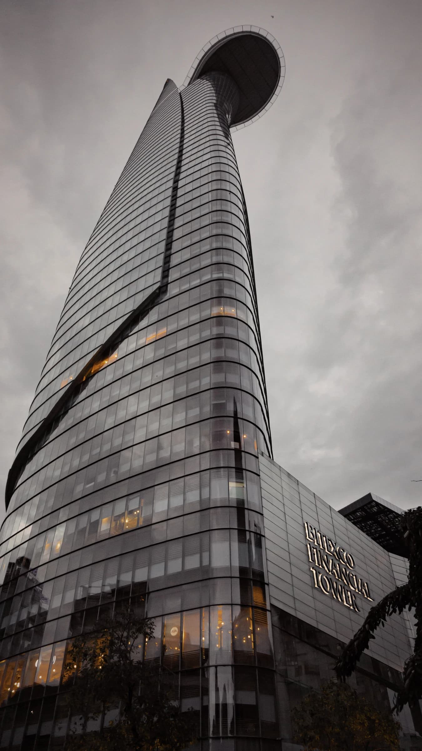 Image of Bitexco Financial Tower in Ho Chi Minh City, Vietnam, against a grey sky.