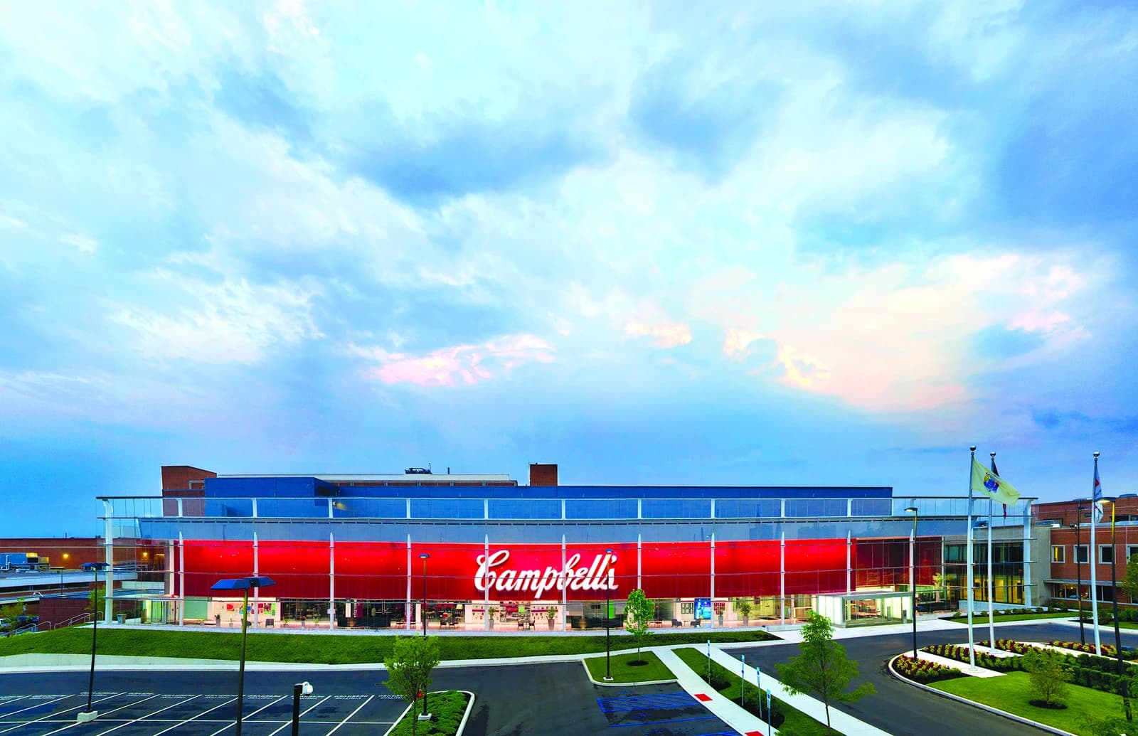 Exterior view of the Campbell Soup Company headquarters building with a large 'Campbell's' logo.
