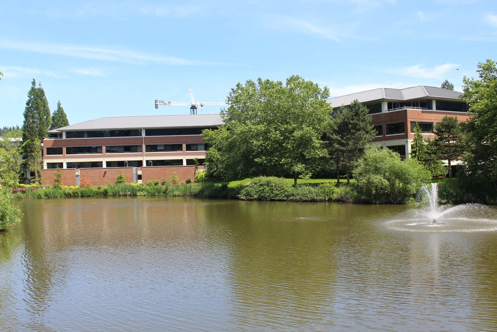 Costco headquarters building in Issaquah, Washington, with a pond and fountain.