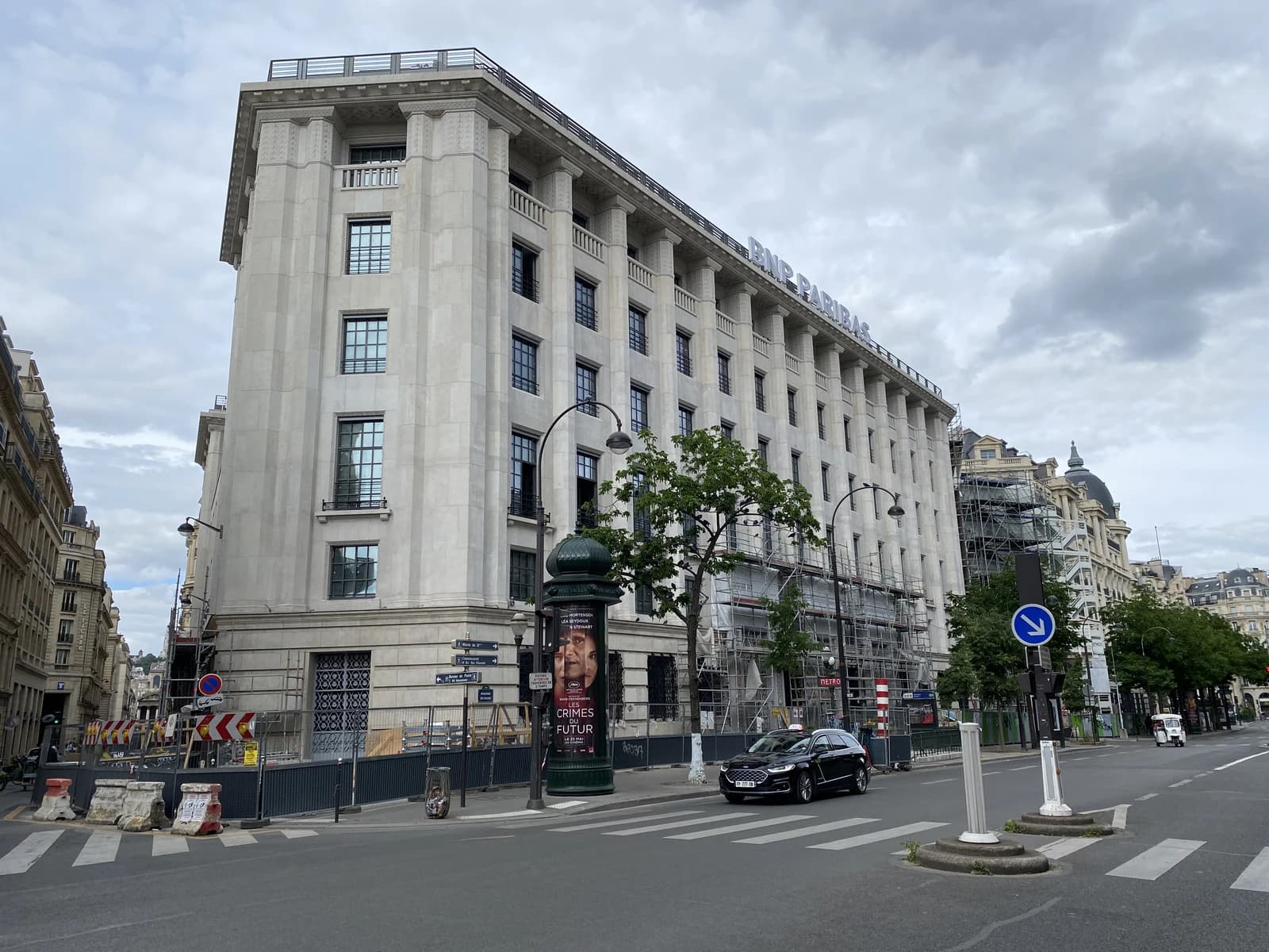 BNP Paribas headquarters building facade on a street in Paris, France.