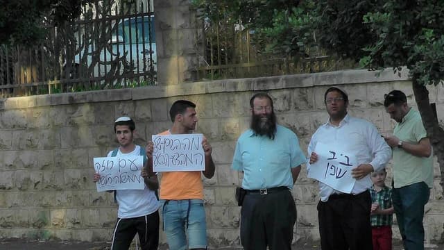 Itamar Ben Gvir, Israeli politician, and Baruch Marzel, activist, demonstrating with signs in Jerusalem.