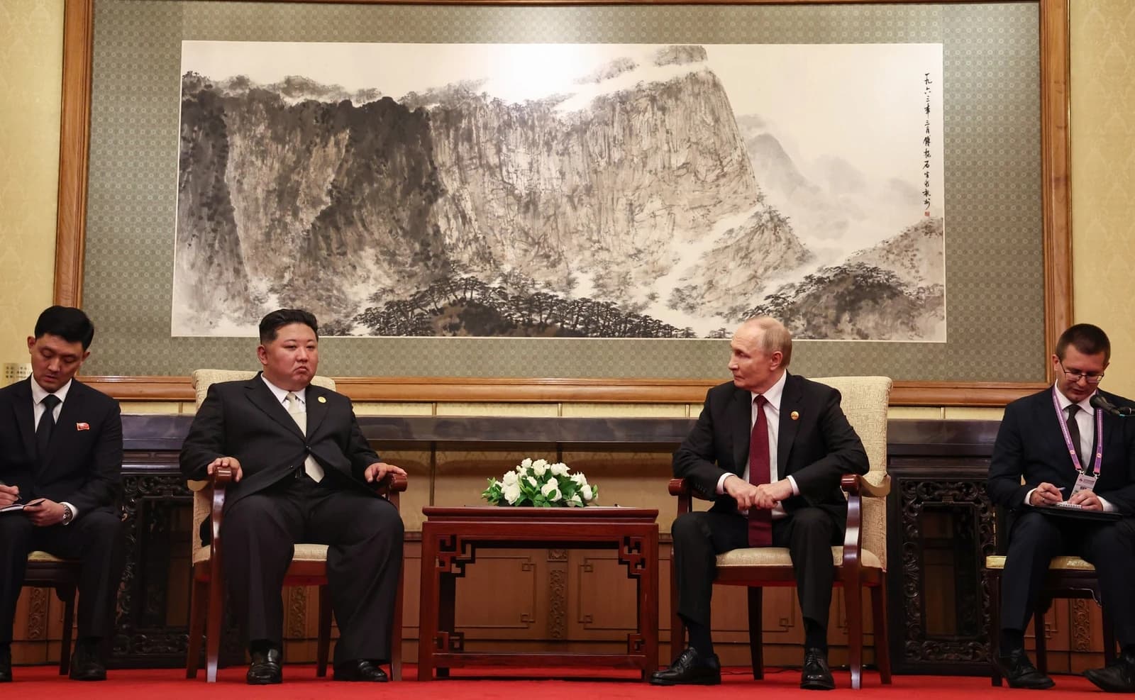 Kim Jong Un, North Korean leader, and Vladimir Putin, President of Russia, seated during a meeting.