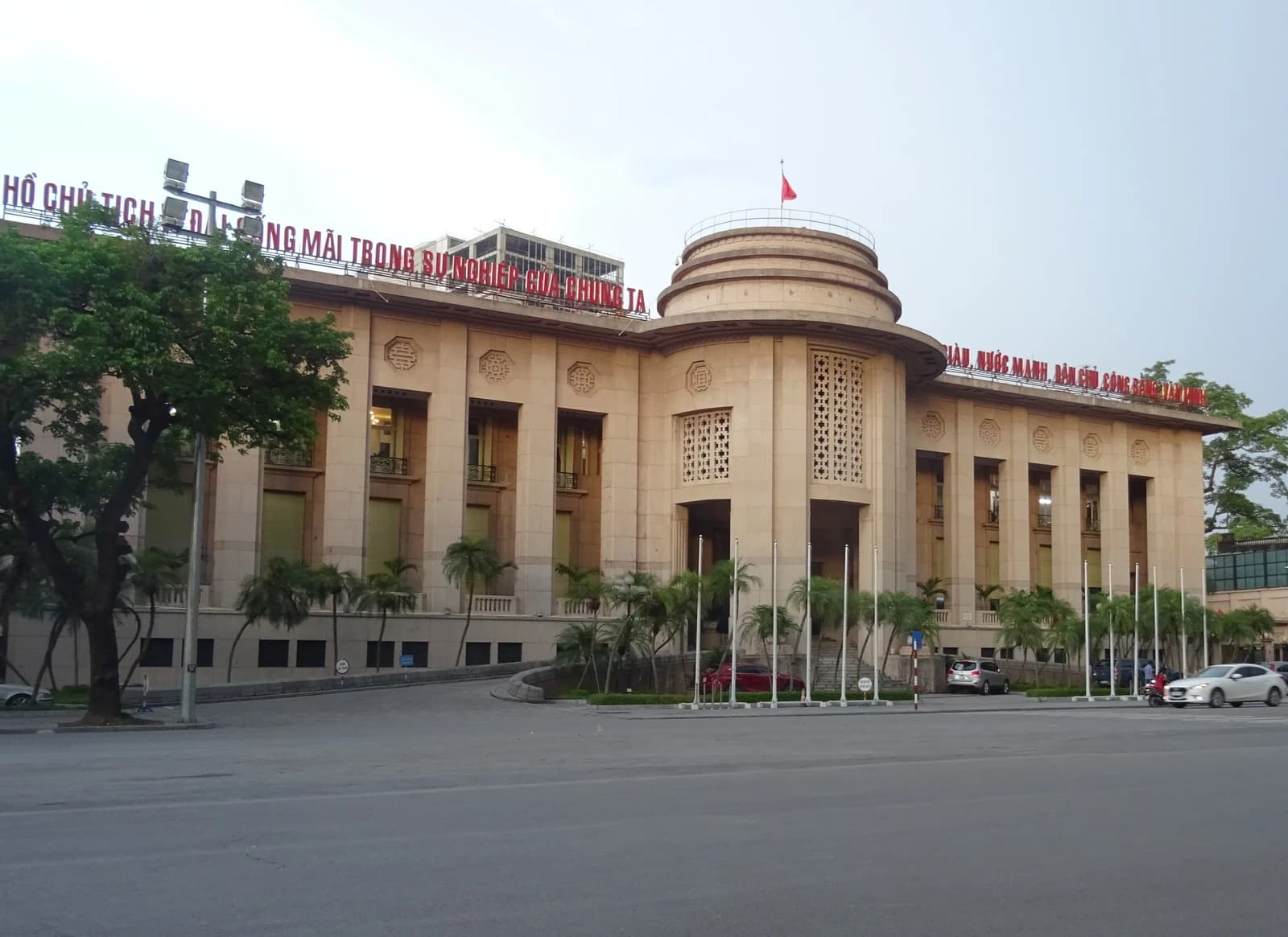 The State Bank of Vietnam headquarters building, a large stone structure, seen from across a street.