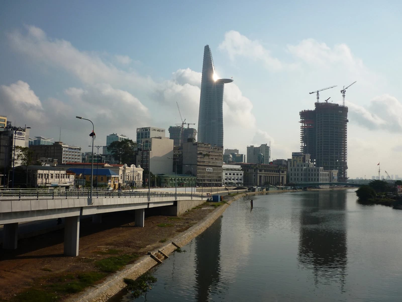 Bitexco Financial Tower and under-construction M & C Tower on a sunny day.