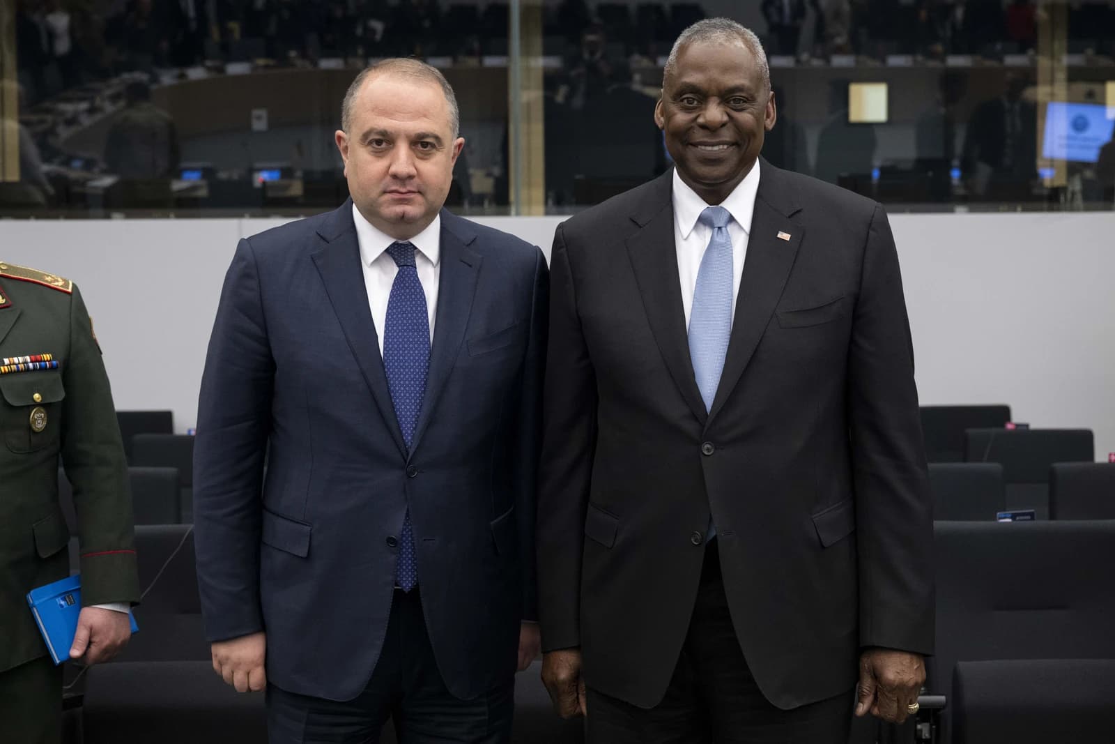 Lloyd Austin, U.S. Secretary of Defense, stands with Irakli Chikovani, Georgia Minister of Defense, in Brussels.